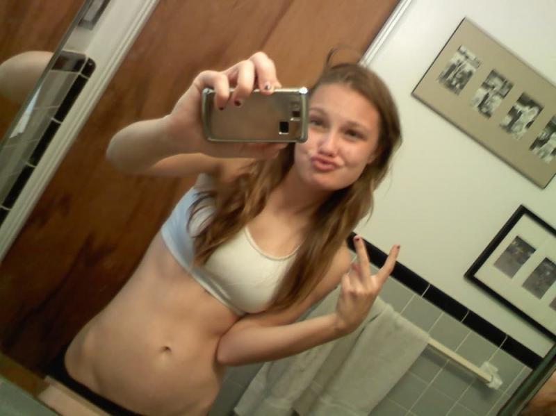 14P Horny amateur babe with round tits teasing and posing