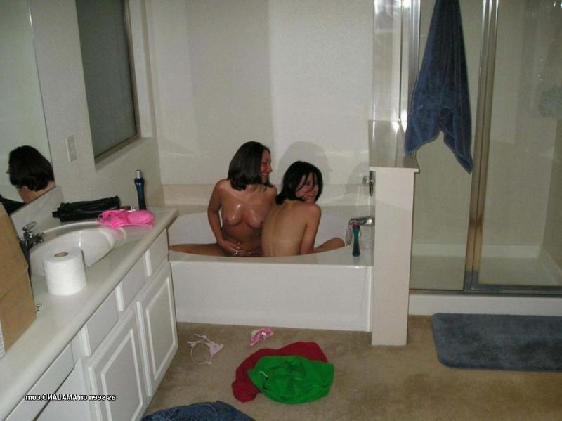 14P Pictures of two amateur teen lesbians fondling each other in the shower