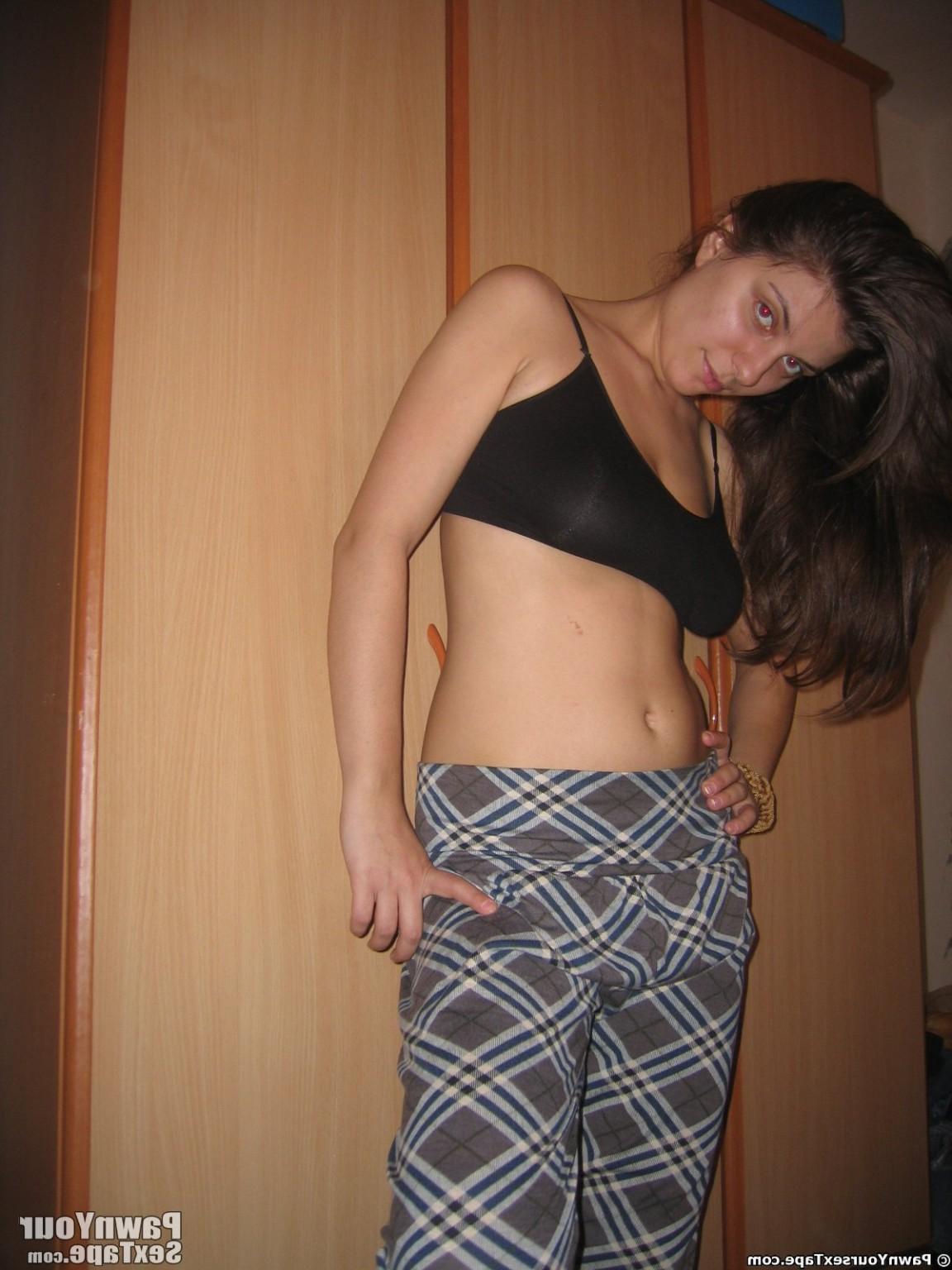 15P Lory grabs the cam in her bedroom and snaps hot pussy pics by herself while she 