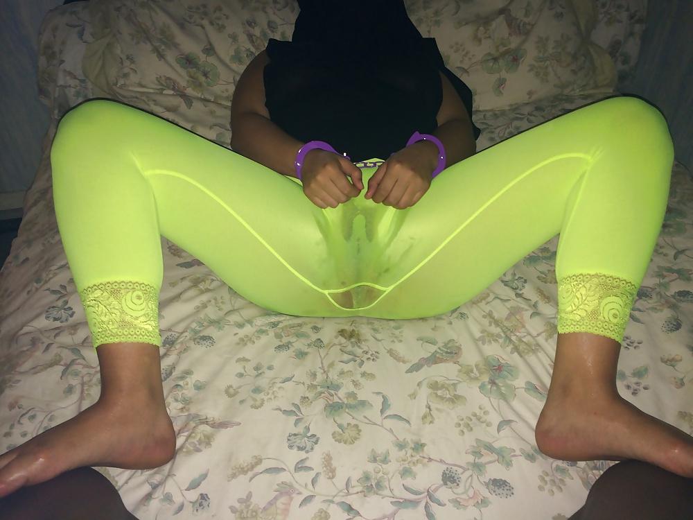 7P Arab hijab in yellow oiled leggins 