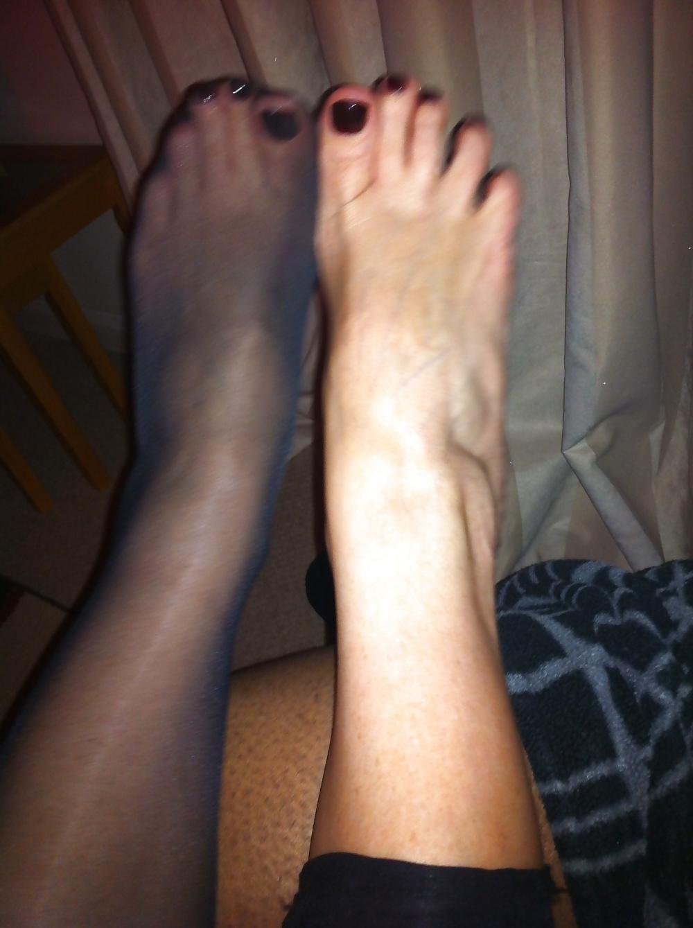 15P Her sexy feet in and out of her hold ups