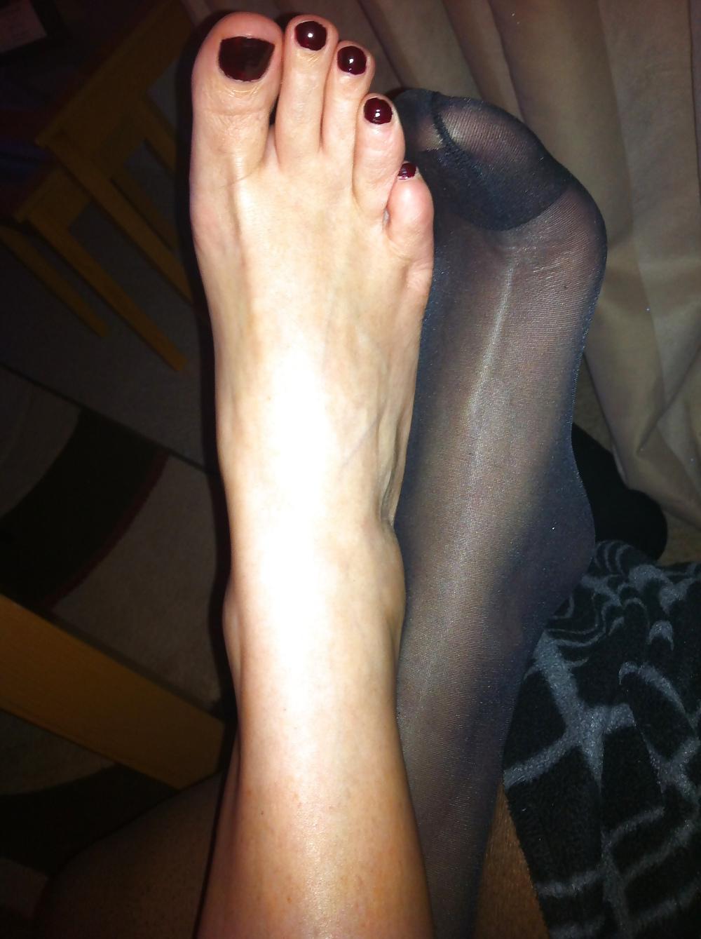 15P Her sexy feet in and out of her hold ups