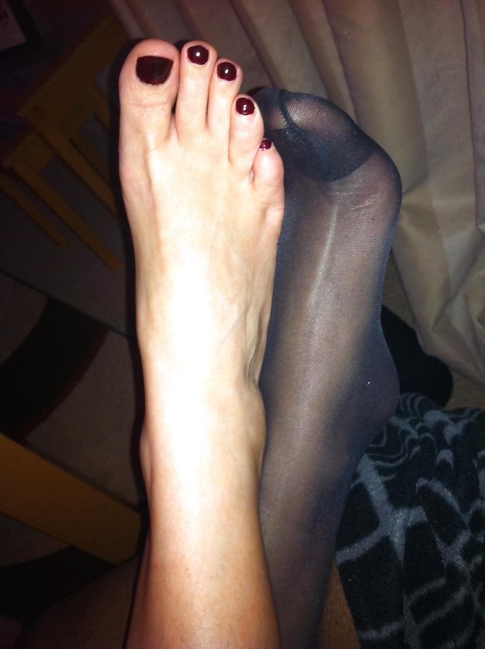 15P Her sexy feet in and out of her hold ups