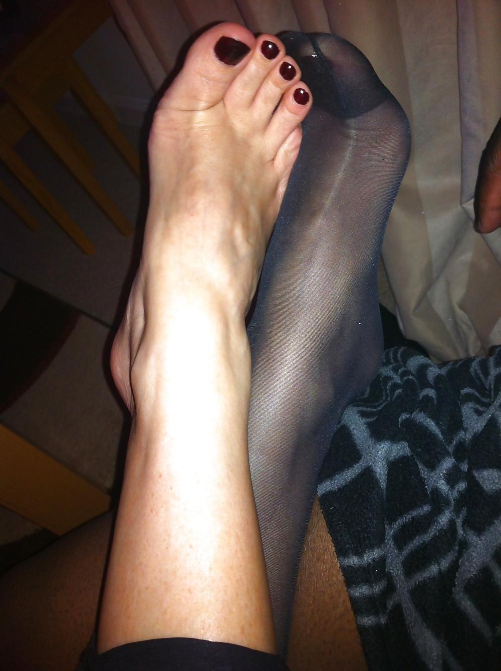15P Her sexy feet in and out of her hold ups