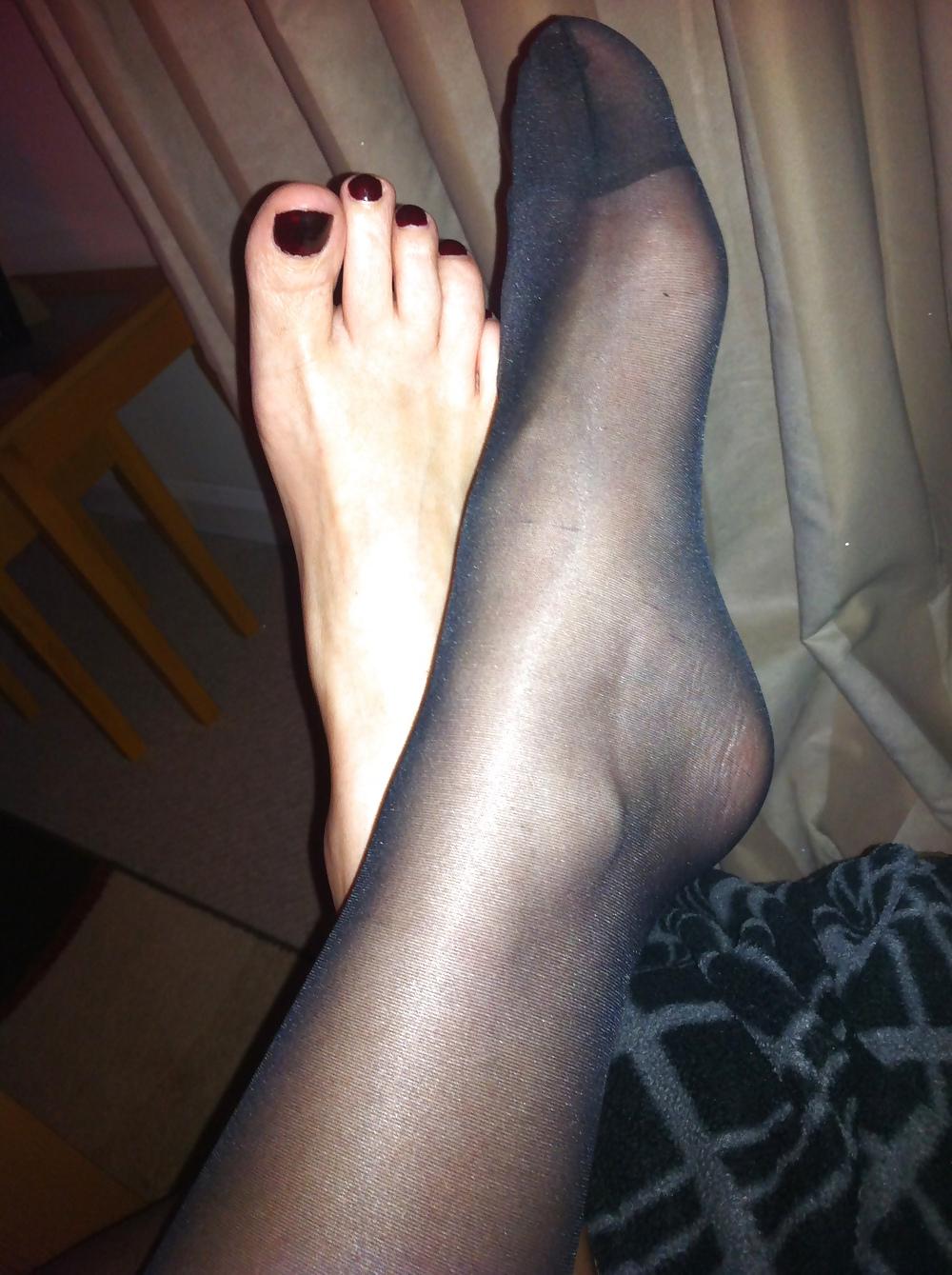 15P Her sexy feet in and out of her hold ups
