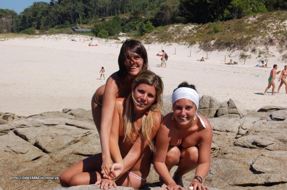 15P Three amateur lesbian teen GFs vacationing topless on the beach