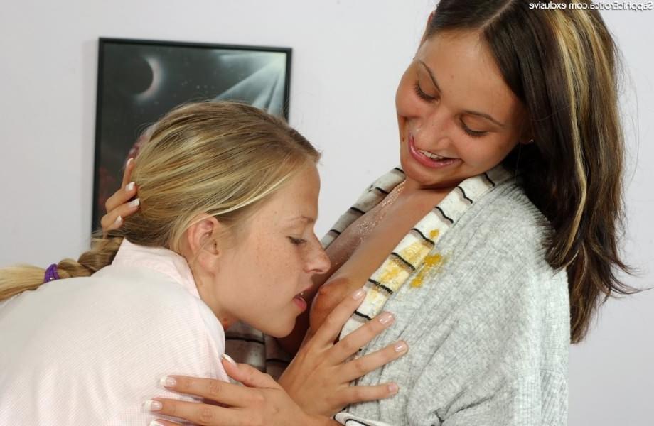 18P Amateur lesbian teens taste pussies and toying in the kitchen