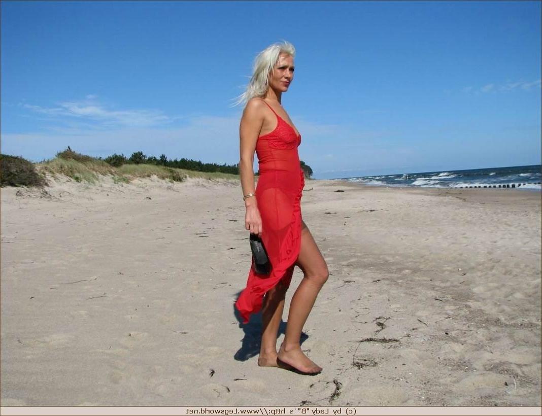 12P Blonde milf in brown stockings strips on the beach