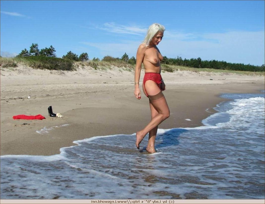 12P Blonde milf in brown stockings strips on the beach
