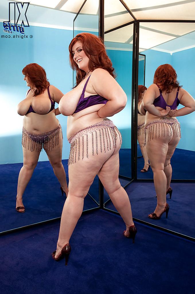 16P Redhead fatty Jade Parker stripping and stuffing her snatch with a huge toy