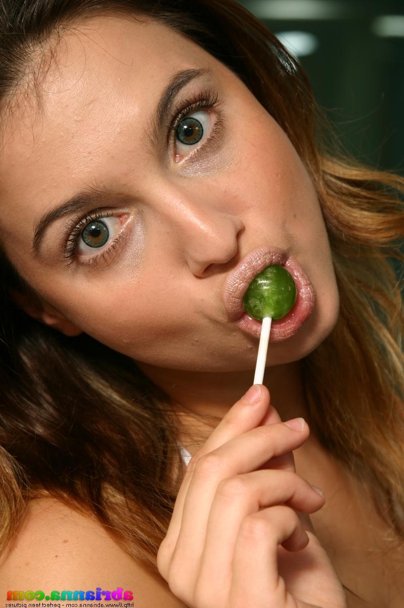 20P Pictures of teen babe Abrianna sucking on a lollipop and flashing her tits