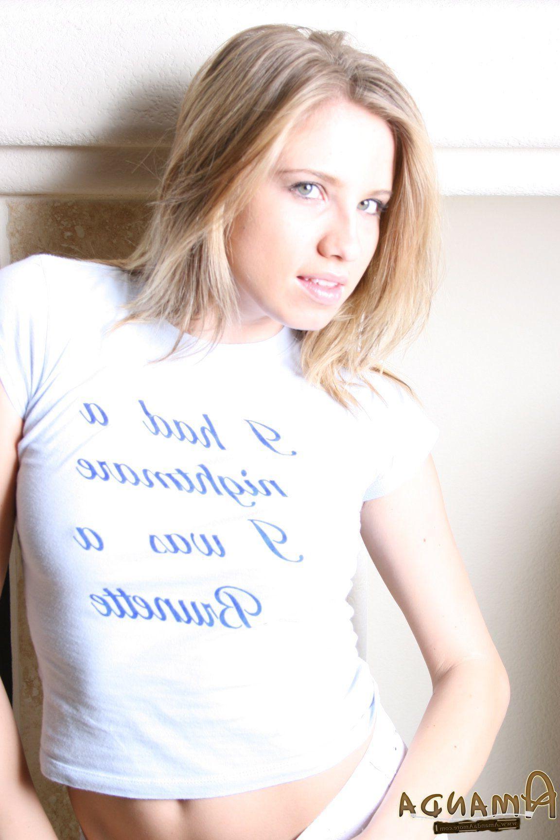 14P Pictures of teen Amanda Amore flaunting by the fireplace