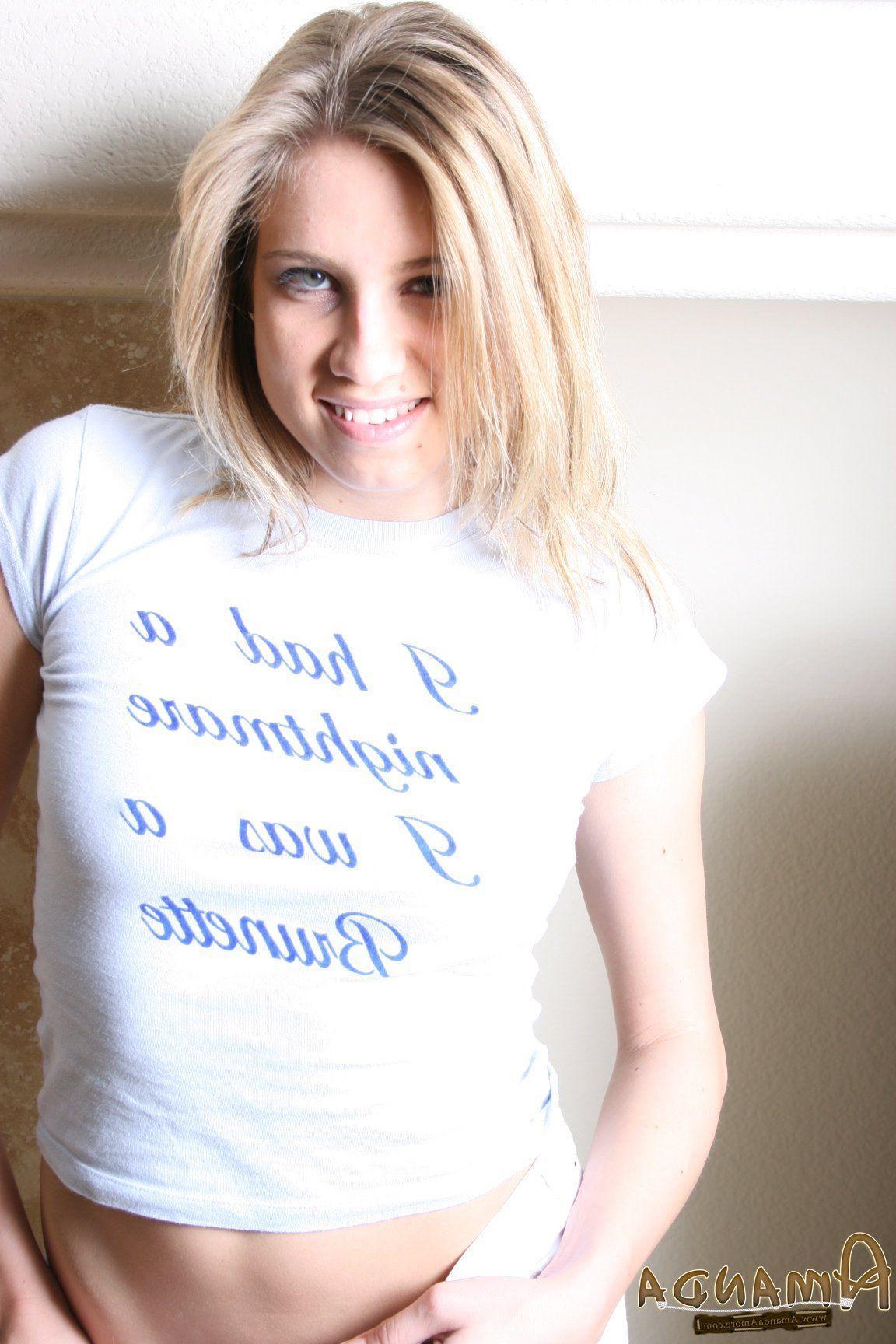 14P Pictures of teen Amanda Amore flaunting by the fireplace