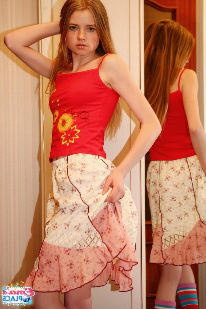 15P Pictures of teen amateur Ema's Place showing off her perky tits