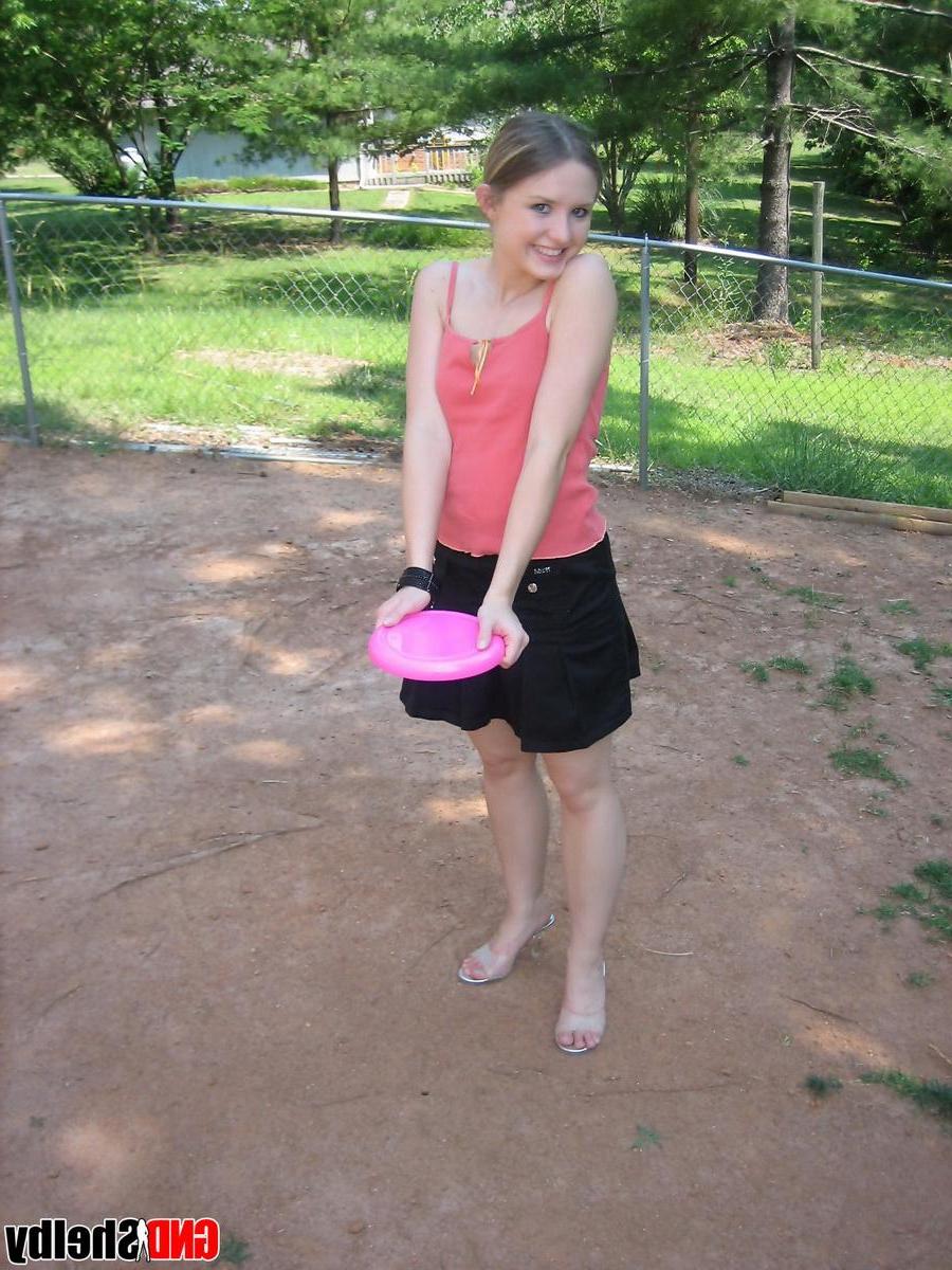 12P Perky teen Shelby flashes her tits outside while playing around