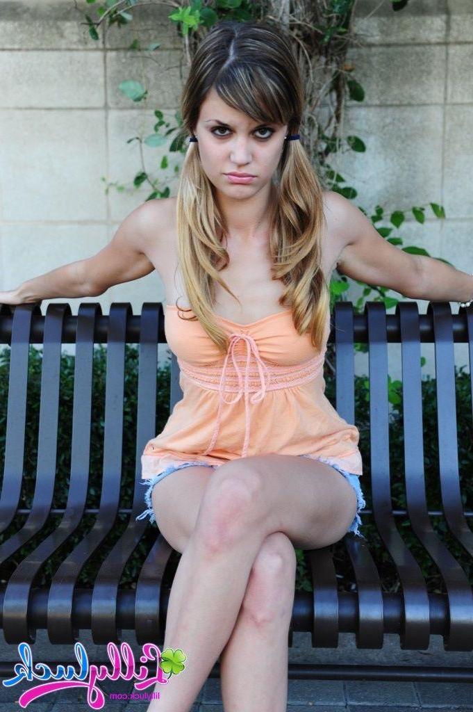 20P Pictures of teen model Lilly Luck flashing her tits and pussy outside
