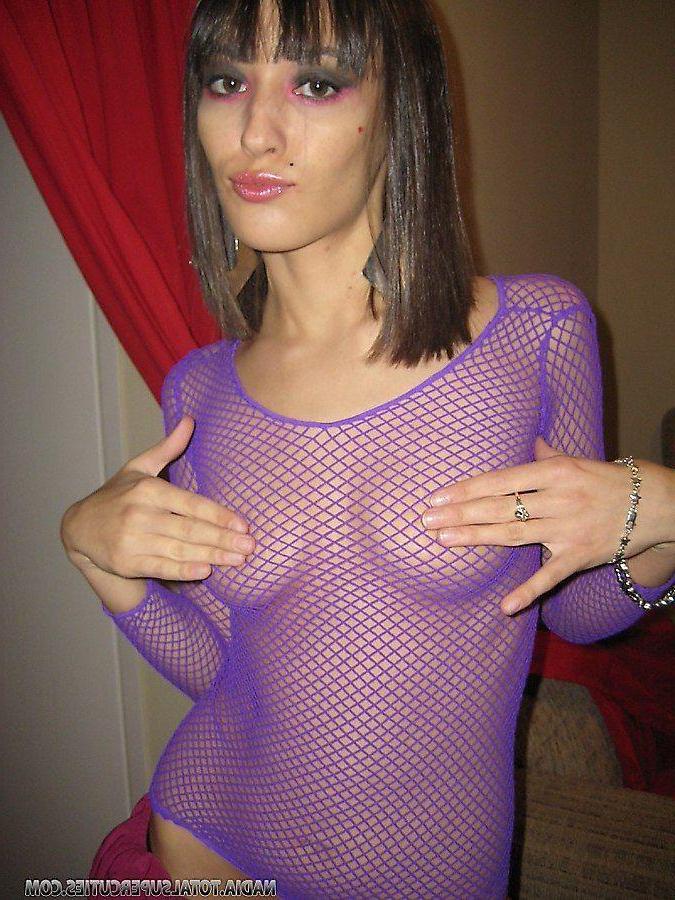 20P Pictures of teen slut Nadia wearing a fishnet dress