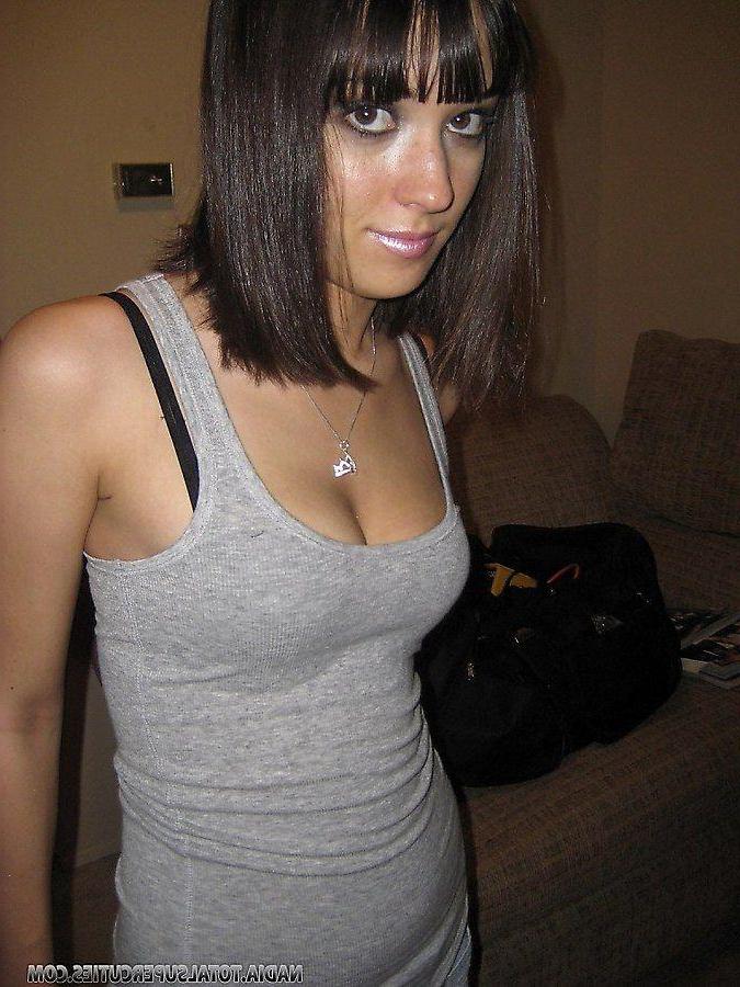 20P Pictures of teen slut Nadia wearing a fishnet dress
