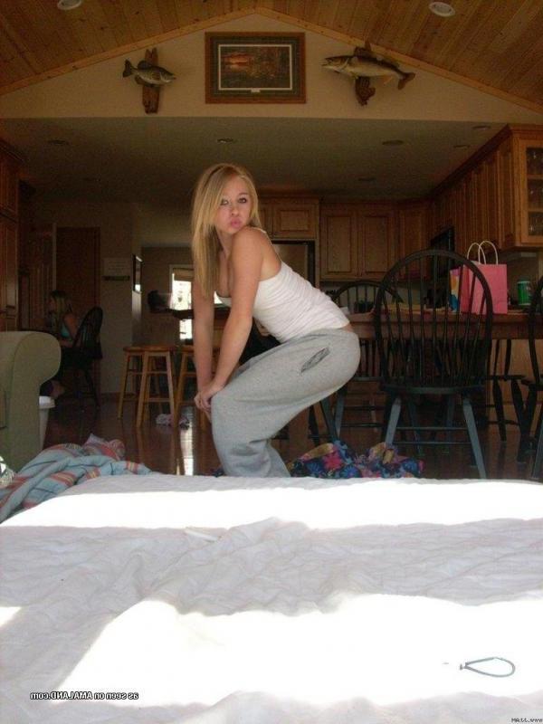 15P Pictures of a cute blonde amateur teen displaying her fine breasts