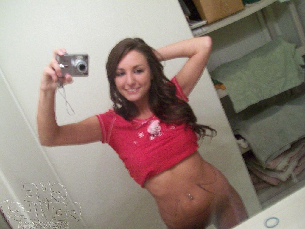 14P Pictures of a hot teen girl with a camera