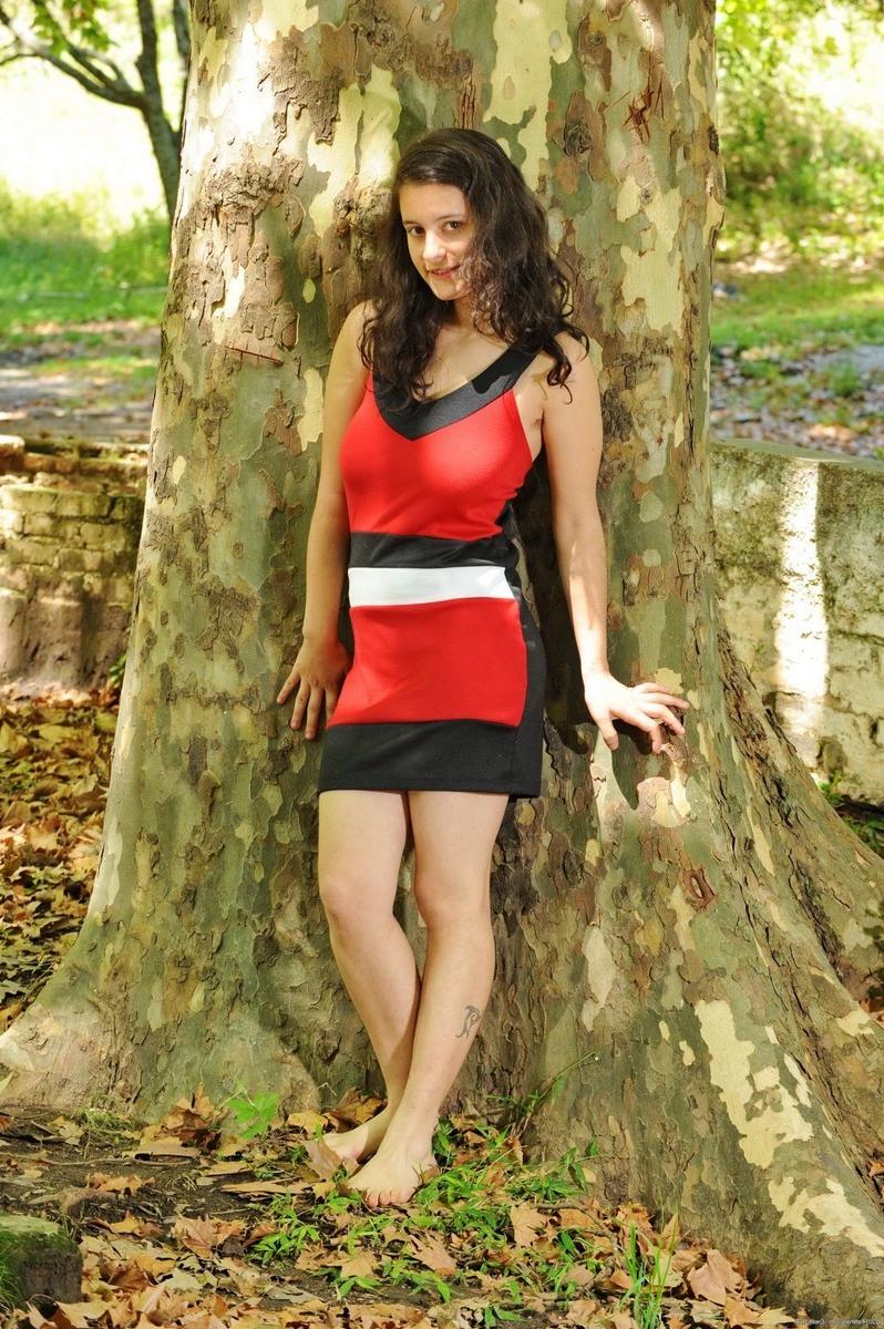 15P Busty hairy amateur teen Mia strip teasing outdoors in nature