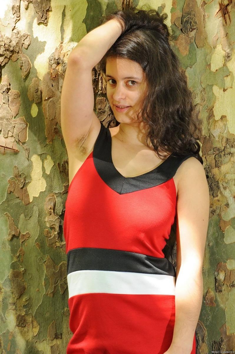 15P Busty hairy amateur teen Mia strip teasing outdoors in nature