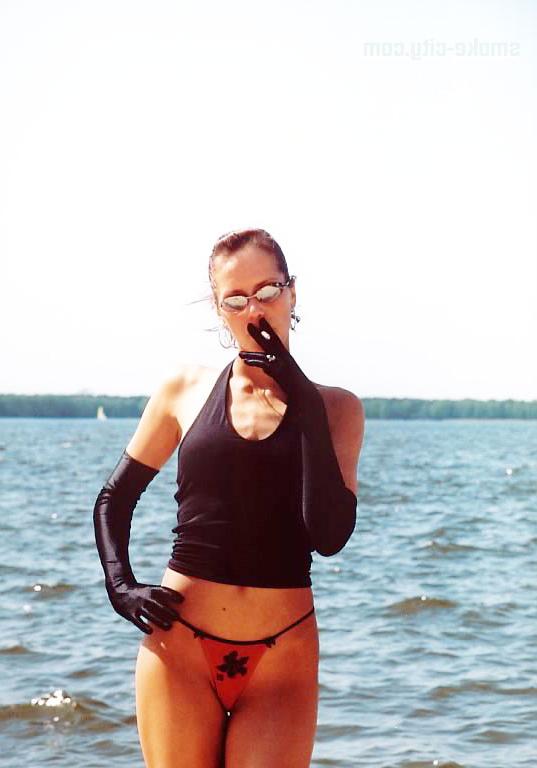 15P Sexy teen attractive smoking on the beach