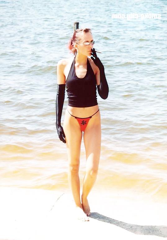 15P Sexy teen attractive smoking on the beach