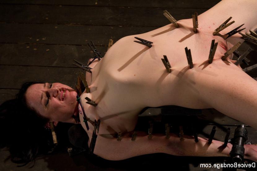 15P Scarlet Faux is whipped in bondage her naked body clamped