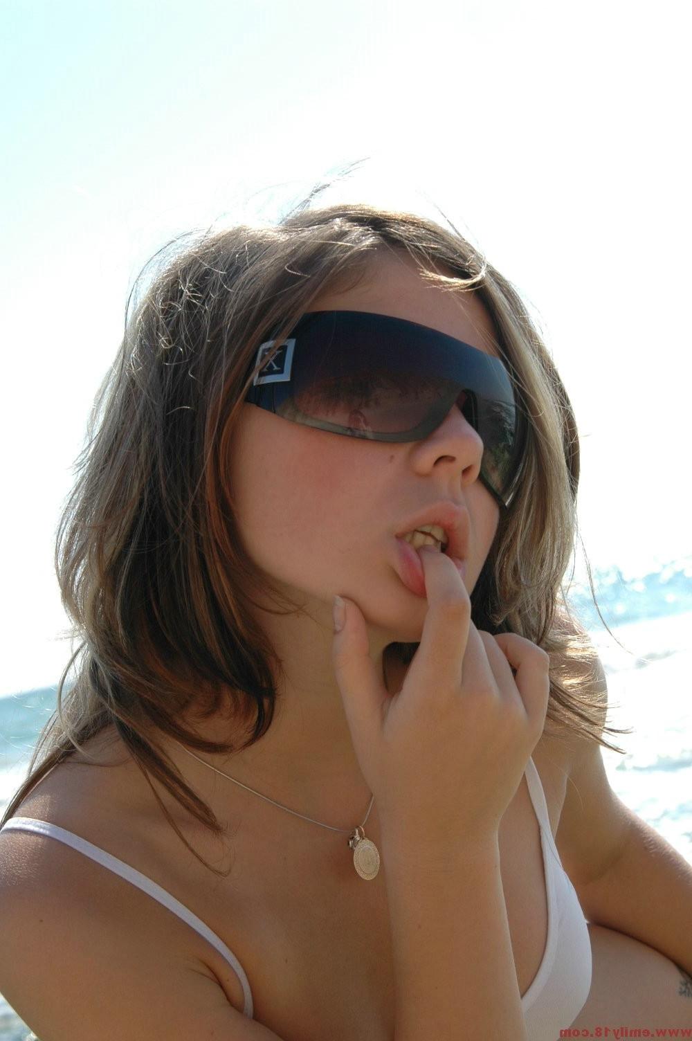 16P Amateur teen girl in bikini and sunglasses at beach
