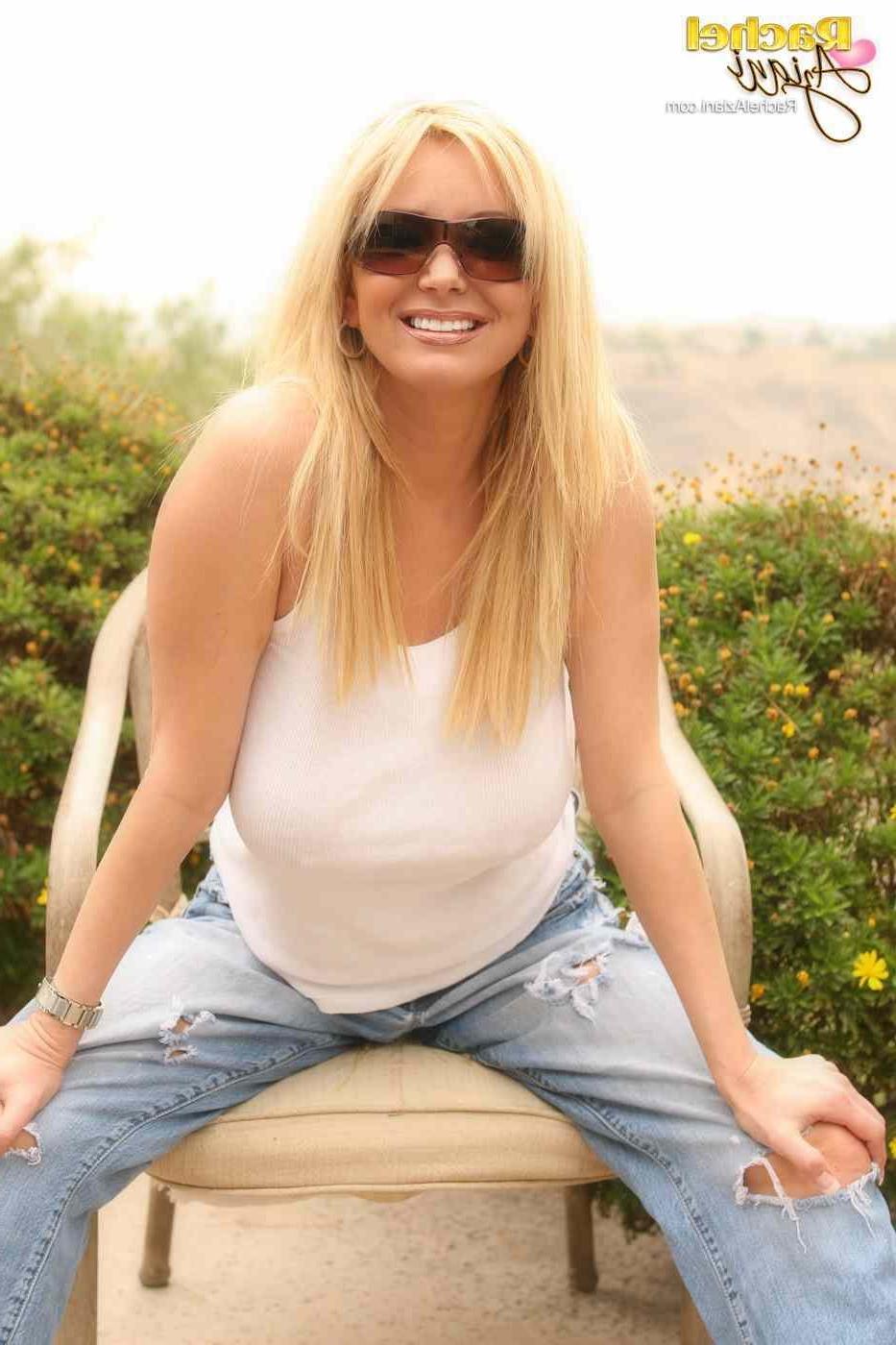 16P Hot busty blonde looking sexy in a white shirt and torn jeans