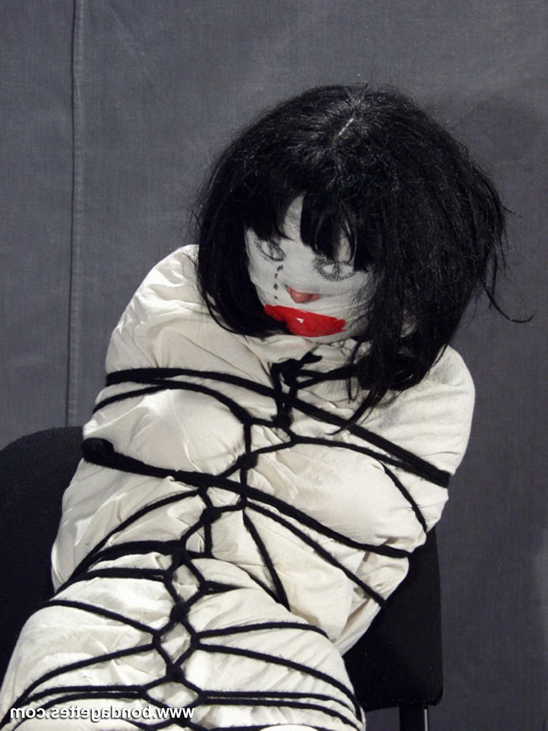 16P Creepy mummification bondage of yummy brunette