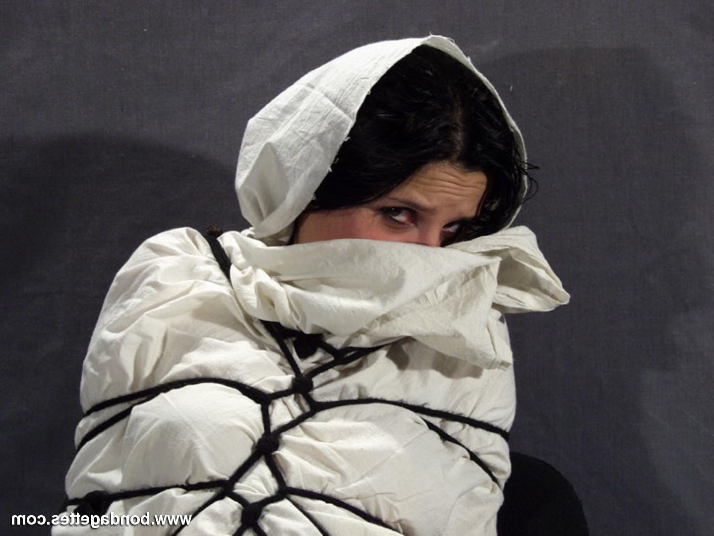 16P Creepy mummification bondage of yummy brunette