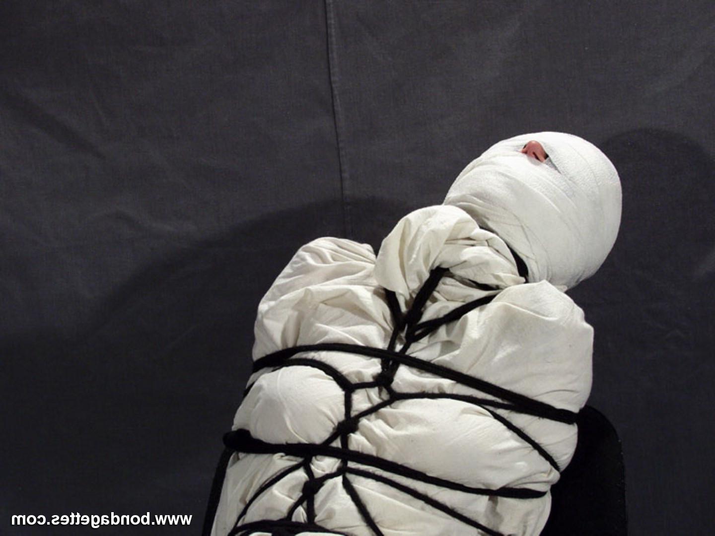 16P Creepy mummification bondage of yummy brunette