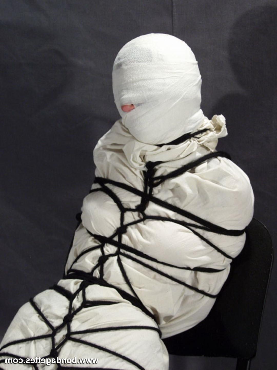 16P Creepy mummification bondage of yummy brunette