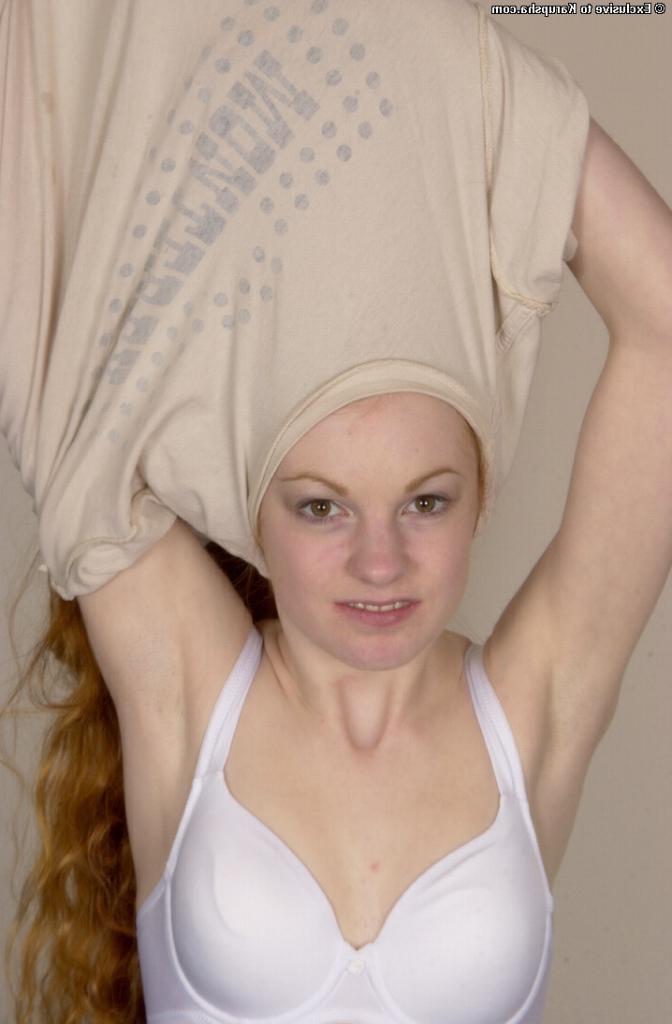 16P A redhead amateur teen babe spreading her pussy