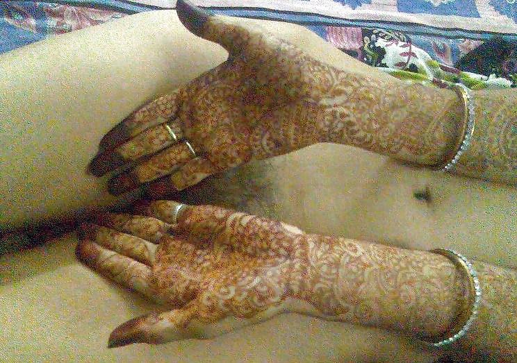 9P Indian newly wife with mehndi on hands