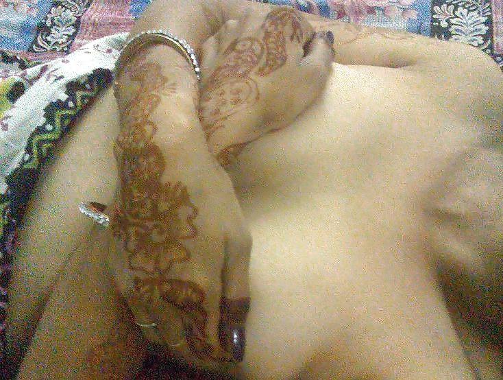 9P Indian newly wife with mehndi on hands