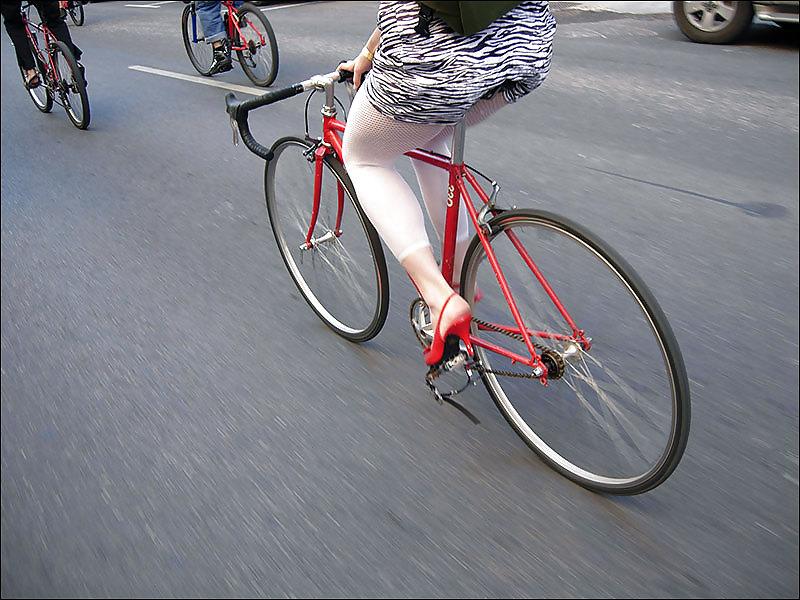 16P Babes riding bicyles in high heels 