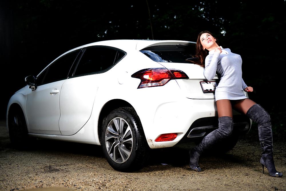 6P Bootfetish: girl in thigh high boots pushing a car 