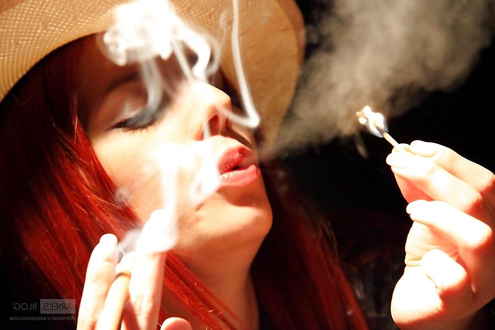15P Smoking teen redhead.