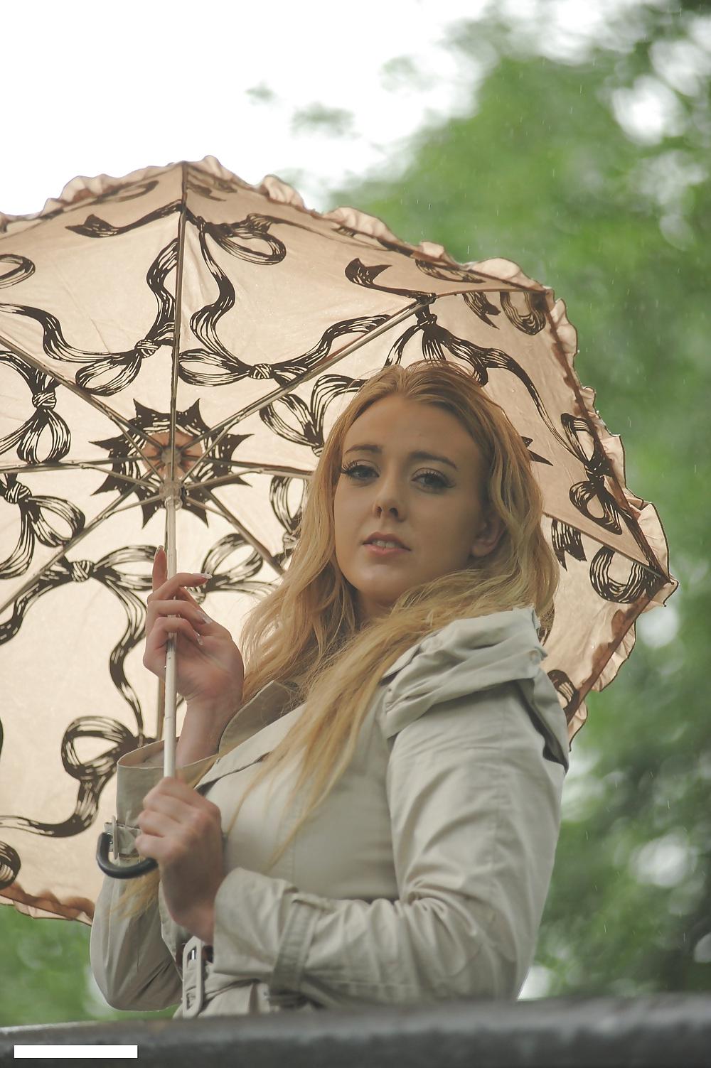 25P Big boobs blonde in raincoat