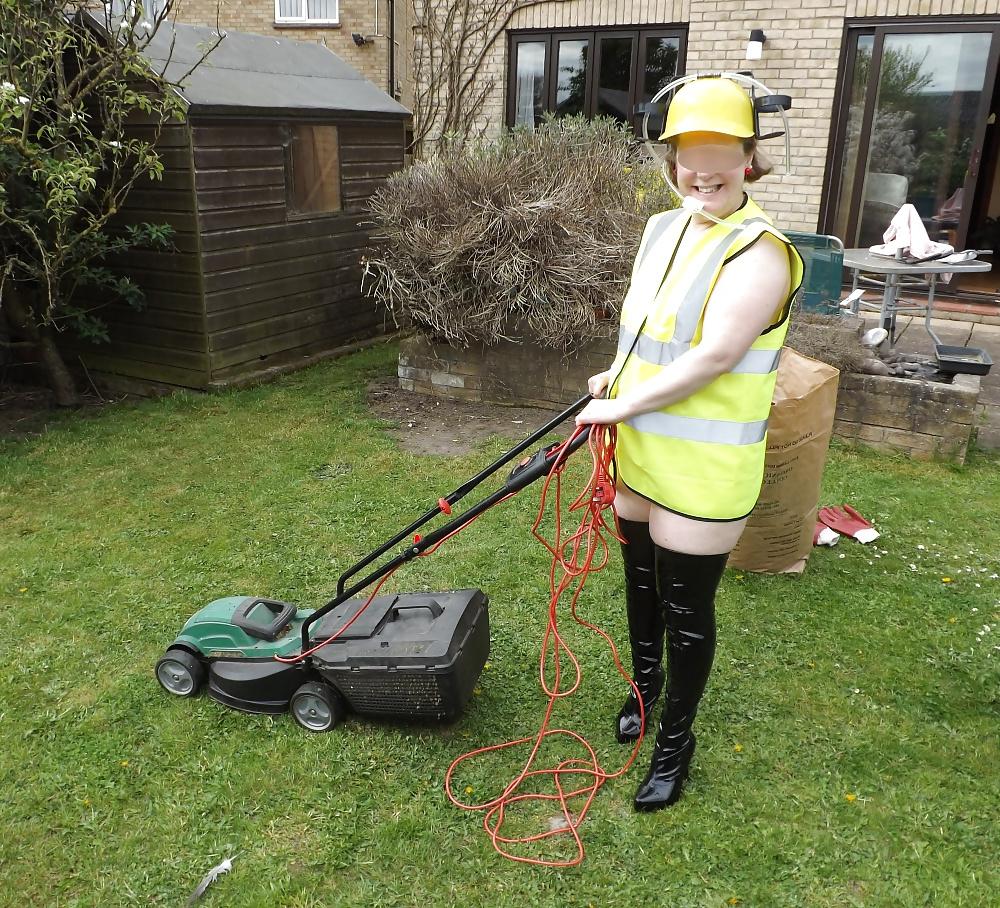12P Mowing the lawn in PVC thigh boots