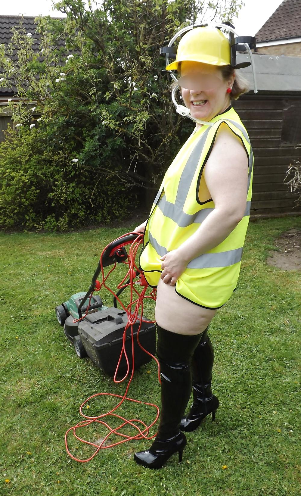 12P Mowing the lawn in PVC thigh boots