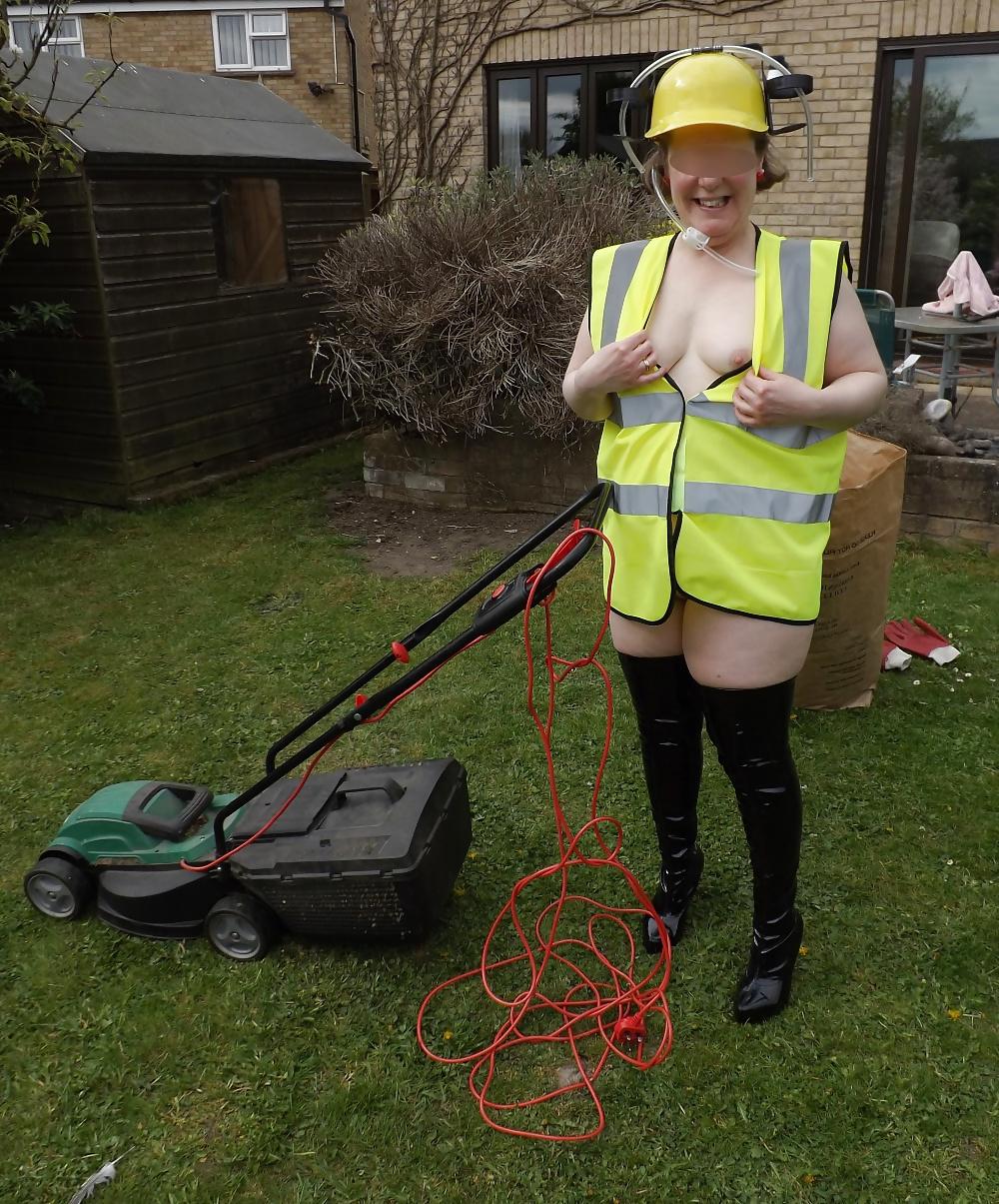 12P Mowing the lawn in PVC thigh boots