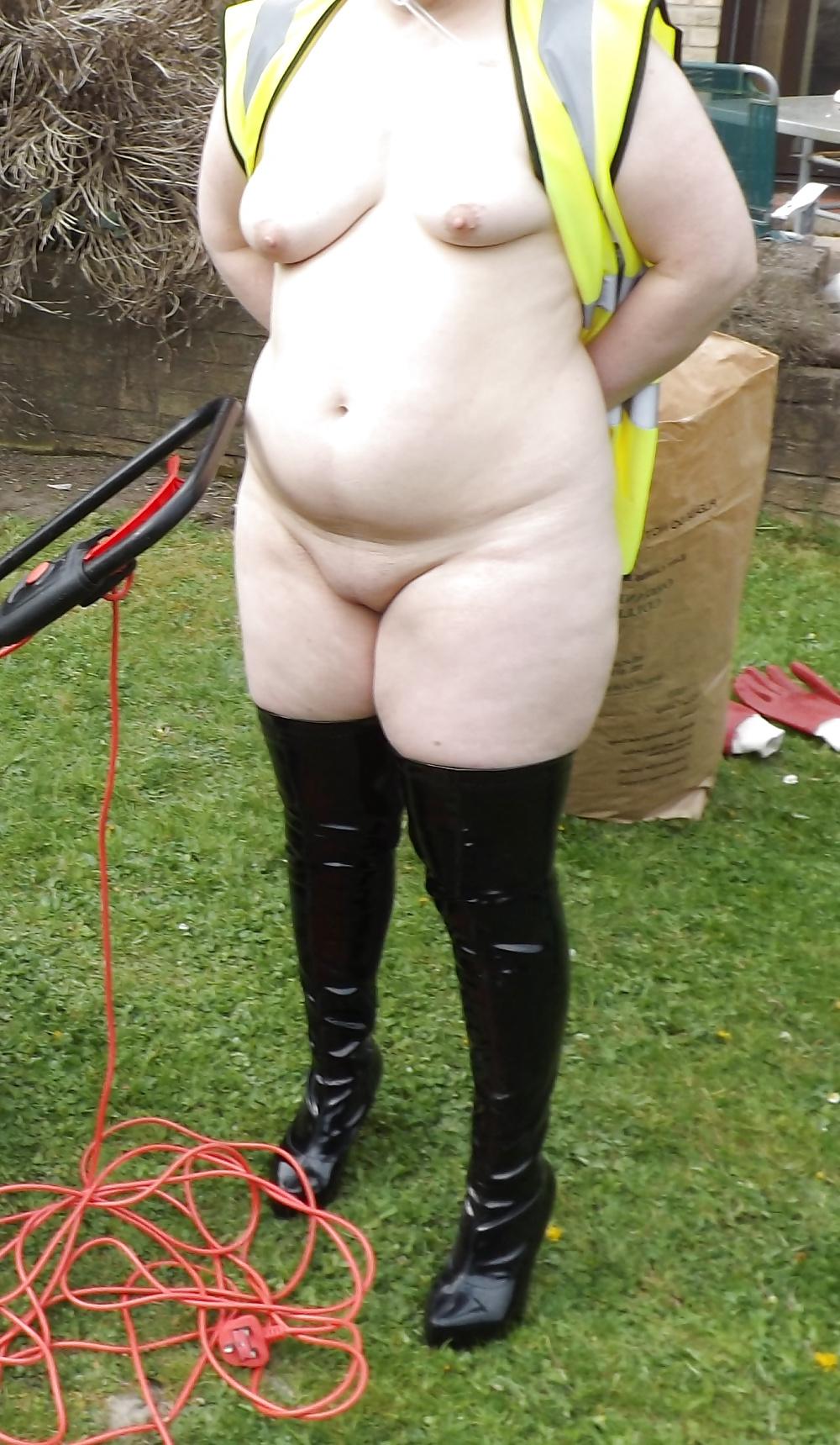 12P Mowing the lawn in PVC thigh boots