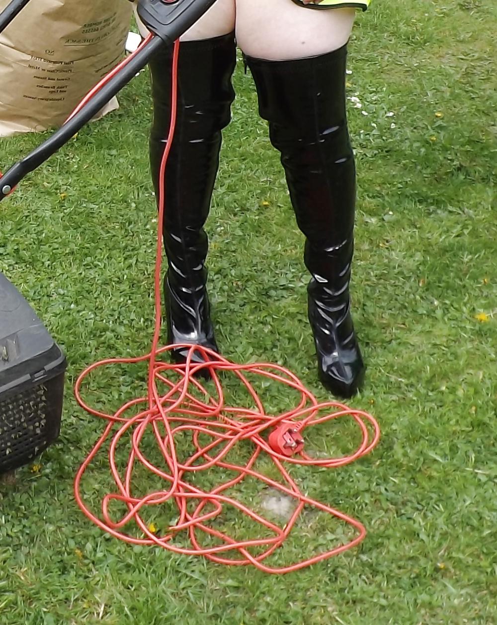 12P Mowing the lawn in PVC thigh boots