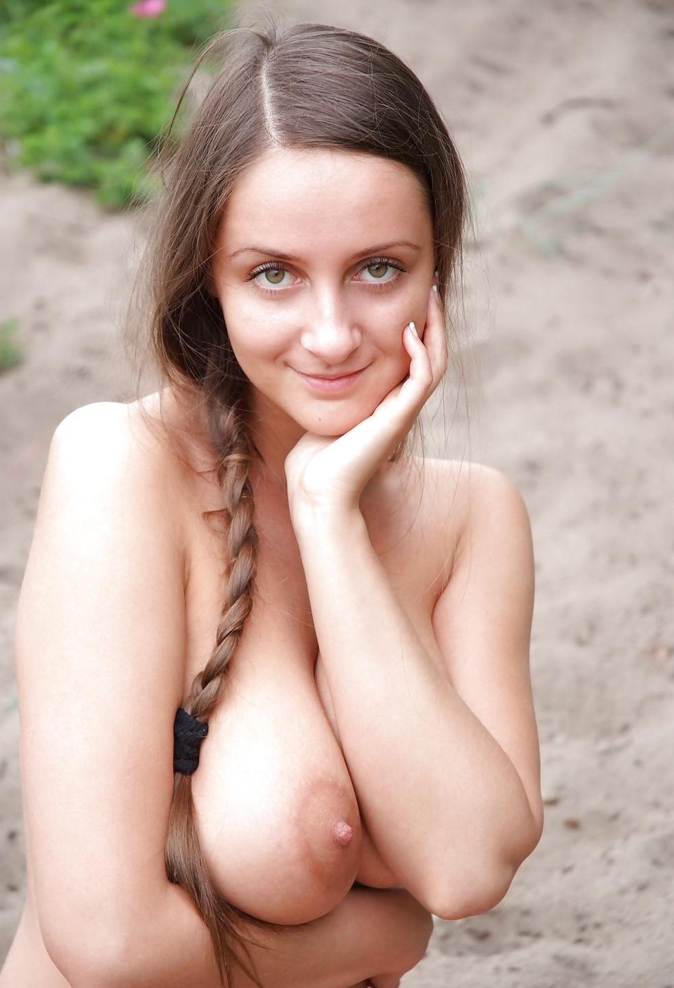 23P Brunette Teen with Big Tits posing outside