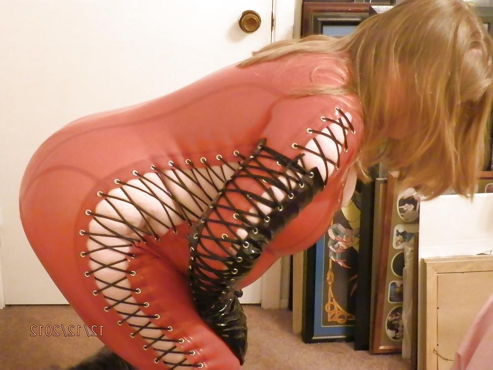 25P Mistress in her red latex catsuit