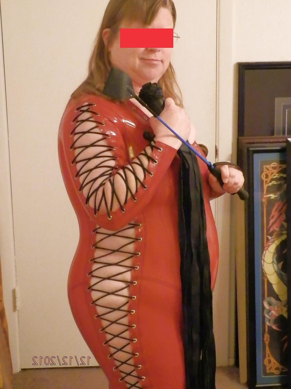25P Mistress in her red latex catsuit